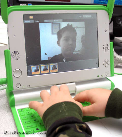 Tristan taking his photo with the OLPC