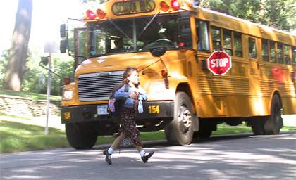 Never pass a stopped school bus.