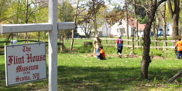 Scouts help clean up at the Flint House